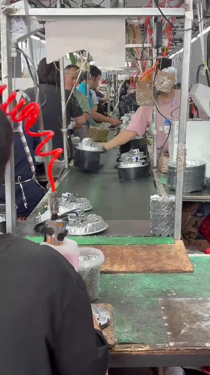Small appliance assembly workshop shown as factory context; exact order and model require separate confirmation